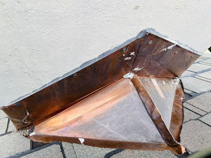 Copper cricket for stucco chimney