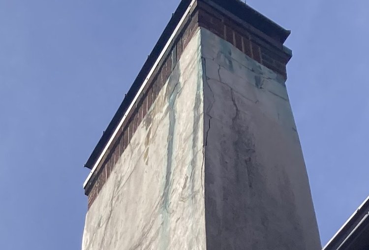 Chimney cap leaking damaging stucco