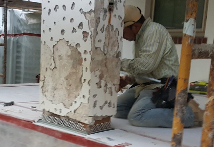 Stucco cut off of columns to put on weeps.