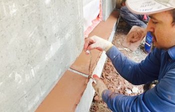 Faux brownstone water table