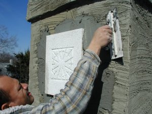 Scaffold cam shows setting the block in place.