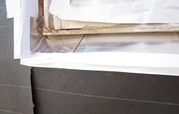 tarpaper and tape we are ready to lath.