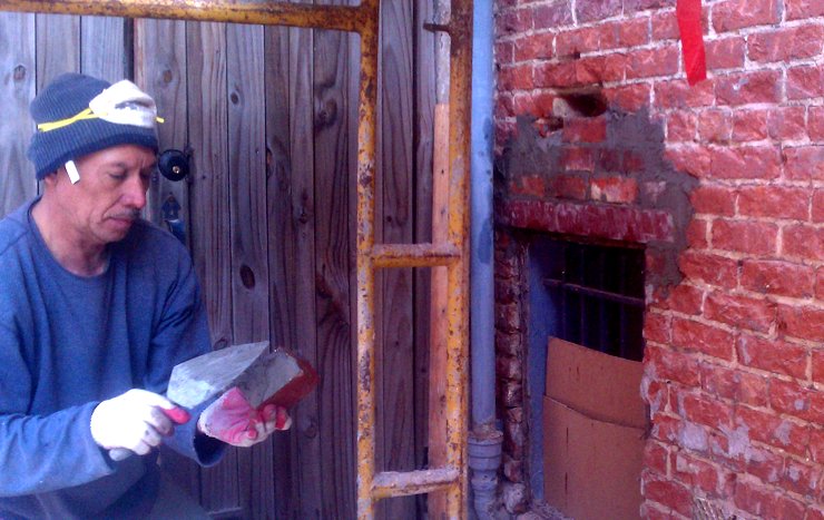 The area over the steel lintel is filled with bricks and super mortar.