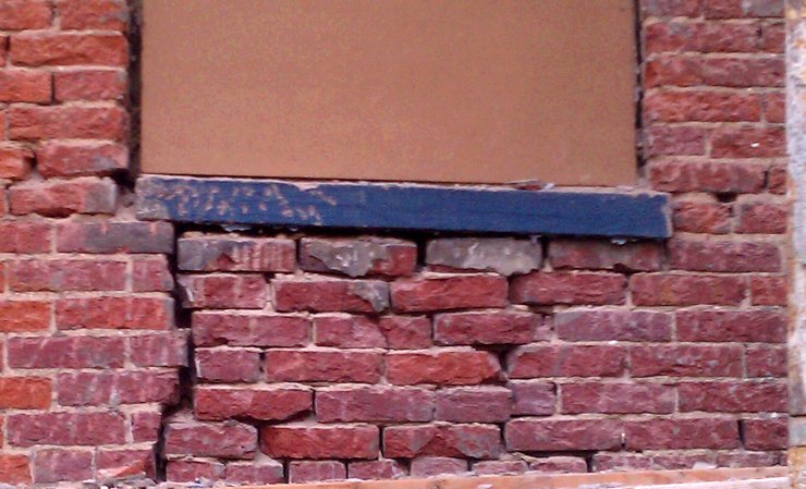 We found the wall in terrible condition when we stripped the stucco off.