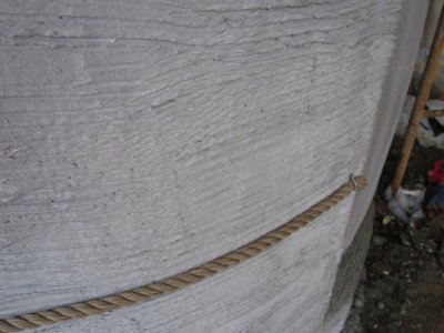 Nails are bent over the rope.