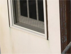 No window sills on the house door.