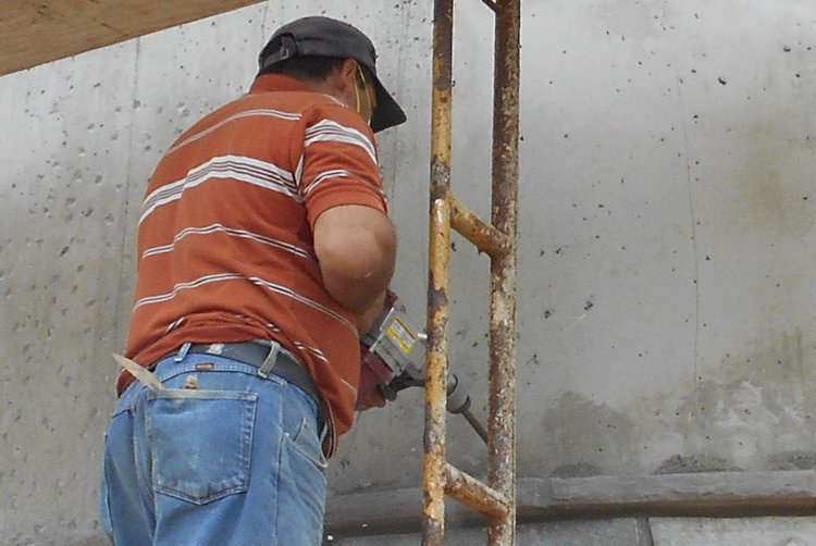 Chipping concrete for a good bond for stucco