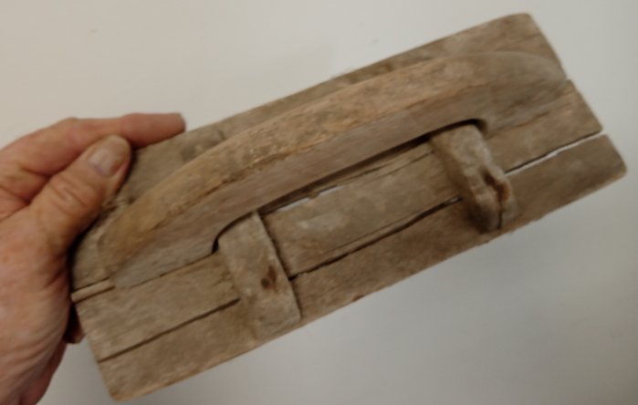 Wood float for lime and sand basecoats.