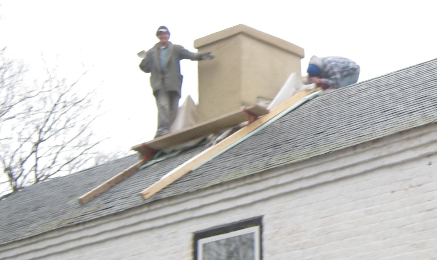Historic masonry chimney repaired.