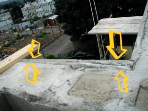 Badly out of square wall is trued up using screeds.