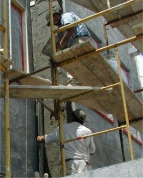 Screed is rodded off between the blocks.