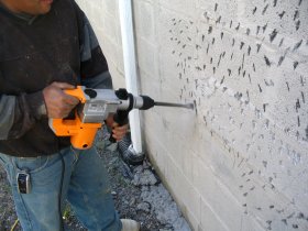 Chipping and bonding stucco on a painted surface.