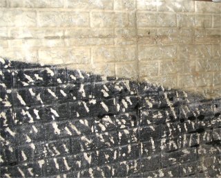 Black waterproofing must be chipped.